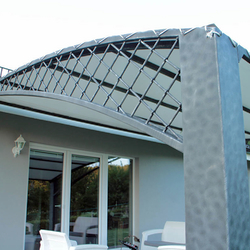 A wrought iron awning in a family house patio A wrought iron awning in a family house patio
