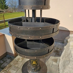 Hand-forged flower pot stand in the shape of a tree for the parish Hand-forged flower pot stand in the shape of a tree for the parish