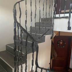 Forged railings for two floors in the entrance hall of a multi-generational family house