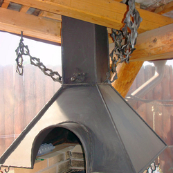 A wrought iron fireplace set