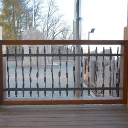 A wrought iron grille pattern - Crazy - in wooden frame on the stage in the pilgrimage place Butkov A wrought iron grille pattern - Crazy - in wooden frame on the stage in the pilgrimage place Butkov