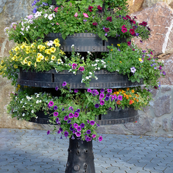 Artistic rotating flower pot hand-forged as a tree with replaceable pots Artistic rotating flower pot hand-forged as a tree with replaceable pots
