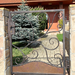 A hand wrought-iron small gate forged in UKOVMI for a family house