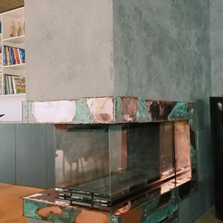 A copper wrought iron fireplace A copper wrought iron fireplace