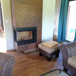A fireplace with a wrought-iron frame made by UKOVMI - forged interior accessories A fireplace with a wrought-iron frame made by UKOVMI - forged interior accessories