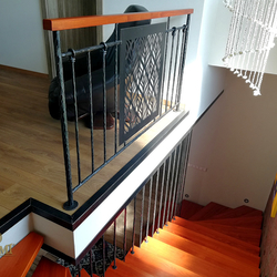 Interior staircase railing in industrial style in a family house