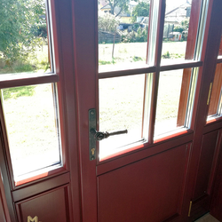 Entrance door decorated with original hand-forged door handle made by UKOVMI