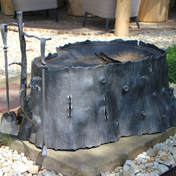 Luxury hand-forged fireplace with fireplace tools with a natural motif Luxury hand-forged fireplace with fireplace tools with a natural motif