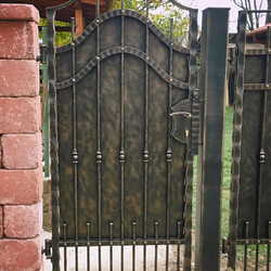 A full wrought iron gate with metal for the cottage