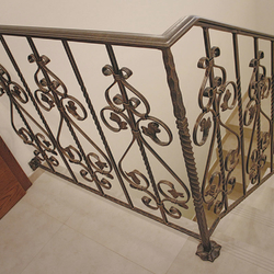 A wrought-iron staircase railing into the cellar  interior railing