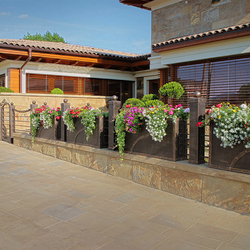 A special forged fence with built-in flower pots, designed and made in the artistic blacksmithing studio UKOVMI A special forged fence with built-in flower pots, designed and made in the artistic blacksmithing studio UKOVMI