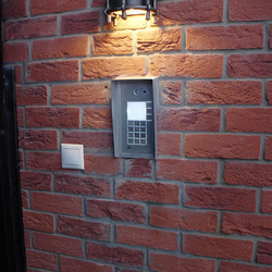 A wrought iron lamp at a family house A wrought iron lamp at a family house