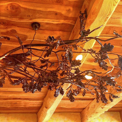 Lustre forg à la main et son design inspir par la nature  clairage exceptionnelle dessine pour un chalet mais pas seulement