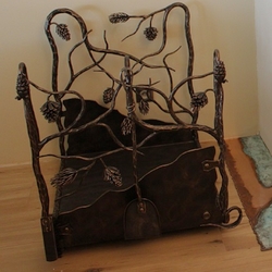 An artistic forged pine-shaped firewood rack – A forged luxurious firewood rack as a fireplace accessory An artistic forged pine-shaped firewood rack – A forged luxurious firewood rack as a fireplace accessory