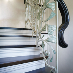 Wrought iron staircase railing in a historic style - a family house Wrought iron staircase railing in a historic style - a family house