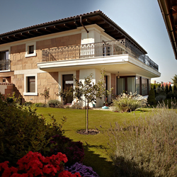 Wrought iron exterior railing - overview of a family house Wrought iron exterior railing - overview of a family house