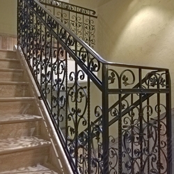 Historic-style railings - high-quality forged railings on a multi-storey staircase Historic-style railings - high-quality forged railings on a multi-storey staircase