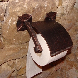 A wrought iron paper roll holder
