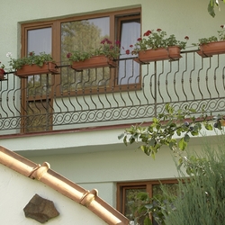 Forged balcony railing with flower pot holders Forged balcony railing with flower pot holders