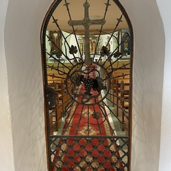 Wrought iron grilles with a cross and a grape in the church in Krsn Lka