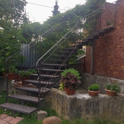 Forged staircase and railing, crafted to serve as aloft apartment entrance in eastern Slovakia