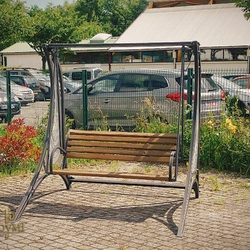 A wrought iron swing combined with wood - a hint of futurism