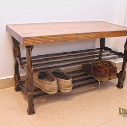 A wrought iron shoe-rack - luxury furniture