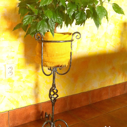 A wrought iron flowerpot