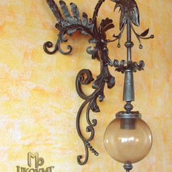 A wrought iron dragon as a light