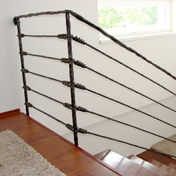 A wrought iron stair railing - Knot pattern