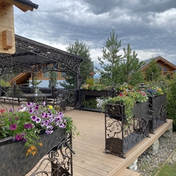 Patio railings with flower pots, decorating a cottage in the High Tatras Patio railings with flower pots, decorating a cottage in the High Tatras