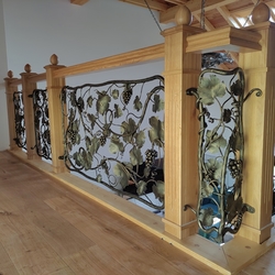 Luxury forged railing with natural vine theme in the interior of a family home Luxury forged railing with natural vine theme in the interior of a family home