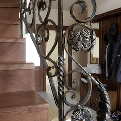 Detail of an interior staircase railing – forged railing by UKOVMI Detail of an interior staircase railing – forged railing by UKOVMI