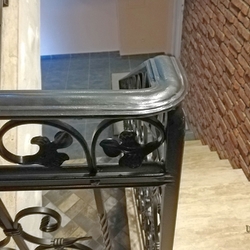 Detail of a helical railing on a multi-storey staircase in the pension - historic design Detail of a helical railing on a multi-storey staircase in the pension - historic design