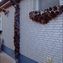 A wrought iron flowerpot A wrought iron flowerpot