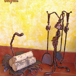 A wrought iron fireplace set