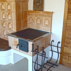 A wrought iron firewood rack A wrought iron firewood rack