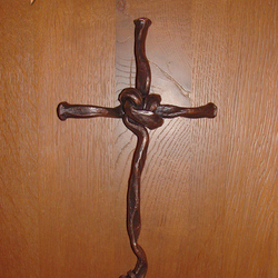 A wrought-iron wall cross