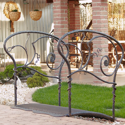 A wrought iron bridge in the garden