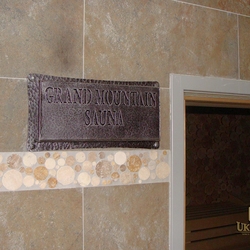 A wrought iron sauna sign