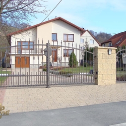 A wrought iron gate made of wrought iron elements