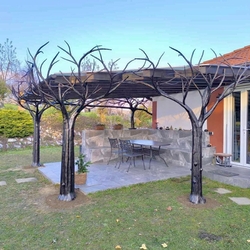 Design shelter on the terrace of a family house created by hand-forged trees Design shelter on the terrace of a family house created by hand-forged trees