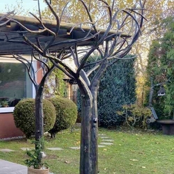 A work of art - a terrace shelter built from hand-forged trees A work of art - a terrace shelter built from hand-forged trees