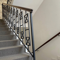 Simple metal railing with wooden handrail  interior staircase railing