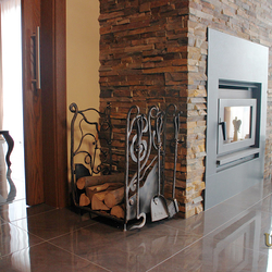 A wrought iron firewood rack from UKOVMI A wrought iron firewood rack from UKOVMI