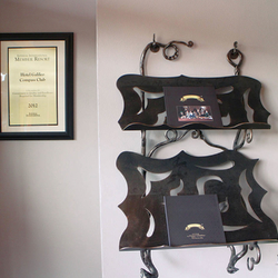 A wrought iron magazine rack