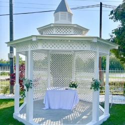 Decorated garden wedding gazebo ready for the wedding ceremony Decorated garden wedding gazebo ready for the wedding ceremony