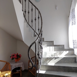 Helical staircase railing in a family home – forged railing