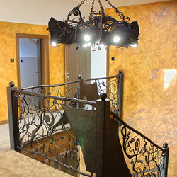 Hand wrought iron interior staircase railing - Roots