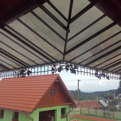 Wrought iron shelter with a natural oak motif - balcony roofing Wrought iron shelter with a natural oak motif - balcony roofing